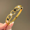 Bracelet Jonc Doré – 2 Trèfles Noirs & 2 Blancs – Acier Inoxydable Femme + Écrin Offert "Ginger Doré" Mara Bijoux